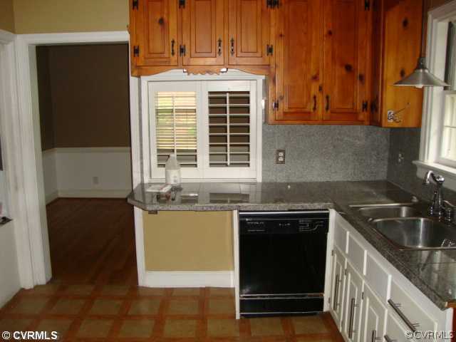 8524 Arran Road Richmond, VA 23235 - Photo 5 of 5 a kitchen with stainless steel appliances granite countertop a stove a sink and a refrigerator