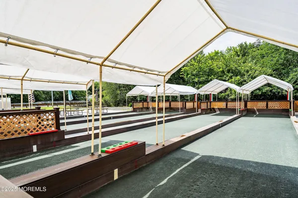 a view of a swimming pool with outdoor seating
