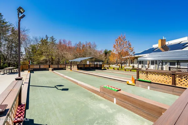a swimming pool with outdoor seating and yard