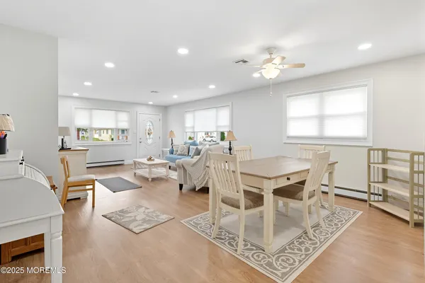 a living room with lots of furniture and a chandelier