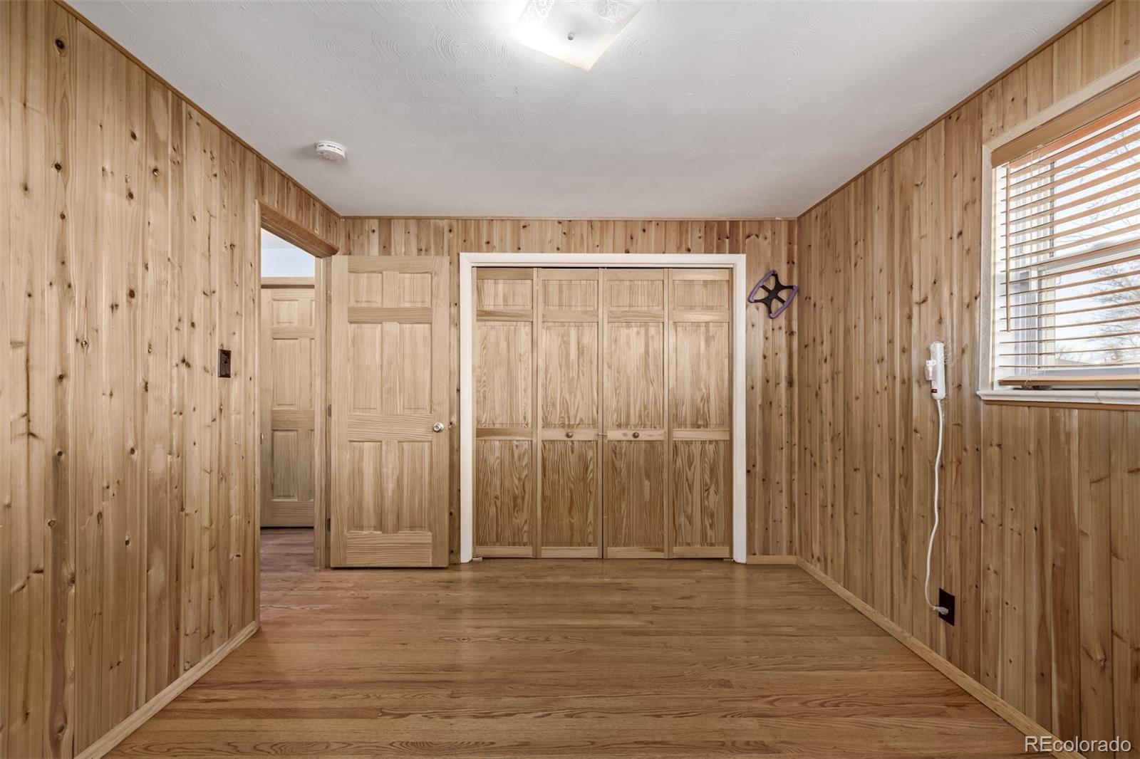8227 Depew Way Arvada, CO 80003 - Photo 16 of 31 a view of a room with wooden floor