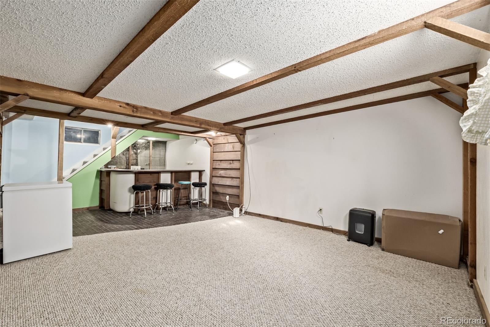 8227 Depew Way Arvada, CO 80003 - Photo 19 of 31 a view of an empty room with furniture