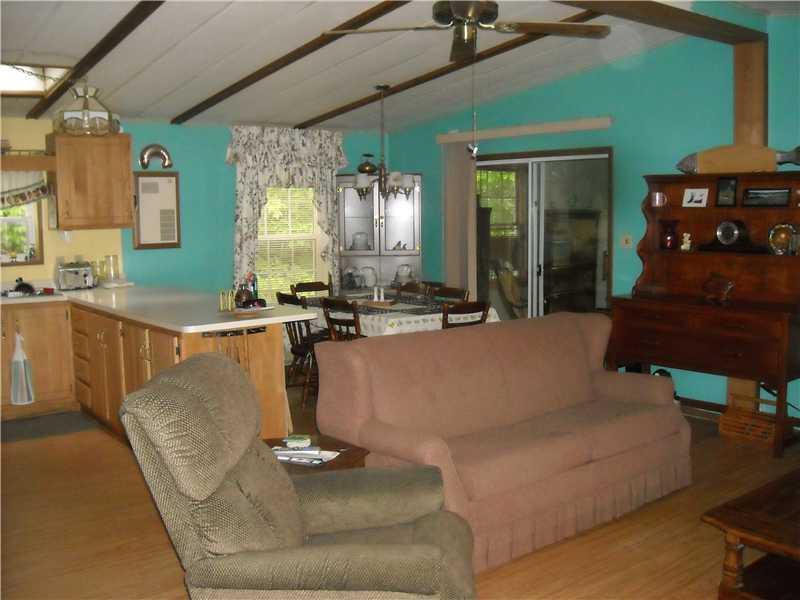 67 Perkins Athens, ME 04942 - Photo 8 of 12 Living Room. Living room open into...