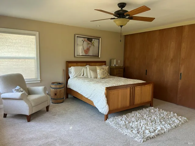 a bedroom with a bed and a couch