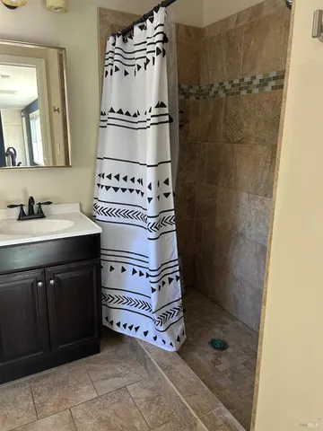 a view of hallway with wooden floor and windows