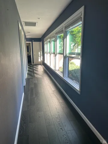 a view of living room with furniture and windows