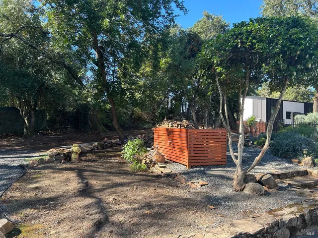a front view of house and yard with green space
