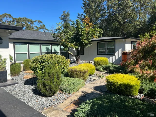 a view of outdoor space with playground and green space