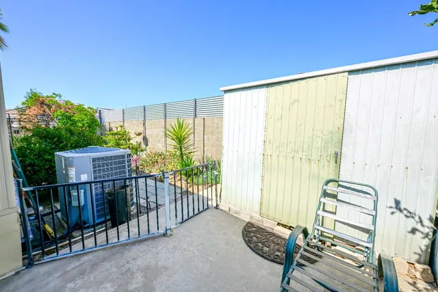 a room with pool table and windows