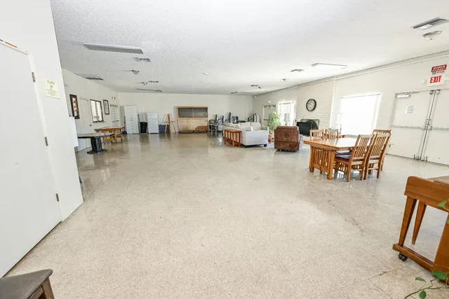 a view of living room with furniture and white walls