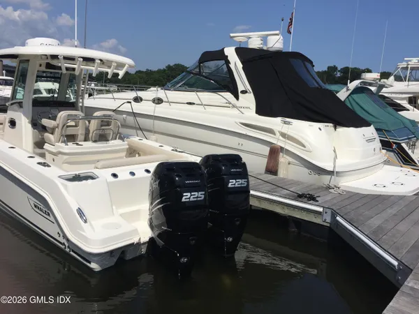 a roof deck with table and chairs