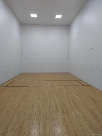 an empty room with wooden floor