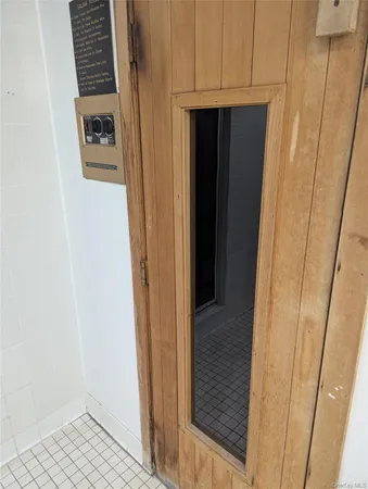 a view of hallway with wooden floor