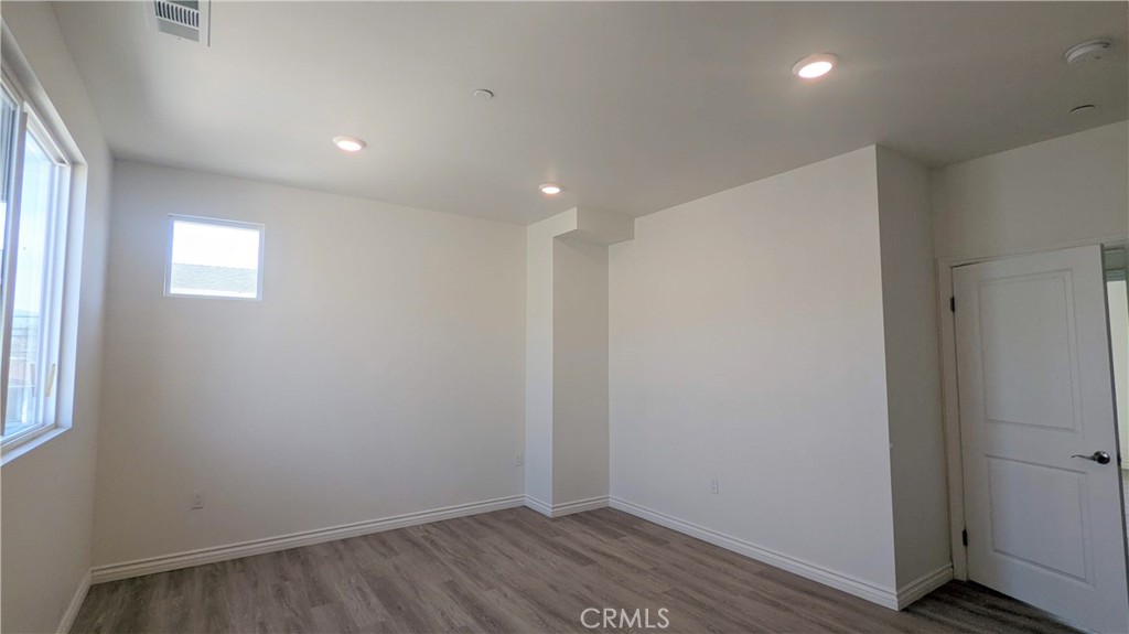 15115 Logos Court North Hills, CA 91343 - Photo 16 of 21 a view of room with window and wooden floor