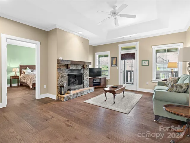 a living room with furniture and a fireplace