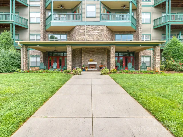 a view of a building with a yard