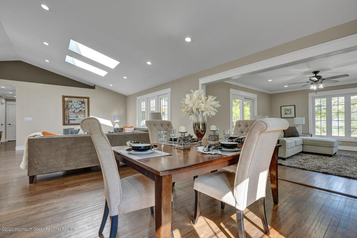 236 Holland Road Holmdel, NJ 07733 - Photo 11 of 42 a view of a dining room with furniture and wooden floor