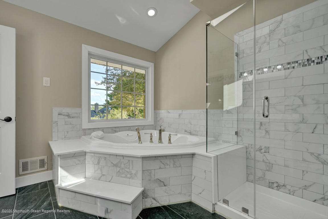 236 Holland Road Holmdel, NJ 07733 - Photo 24 of 42 a bathroom with a sink and a bathtub