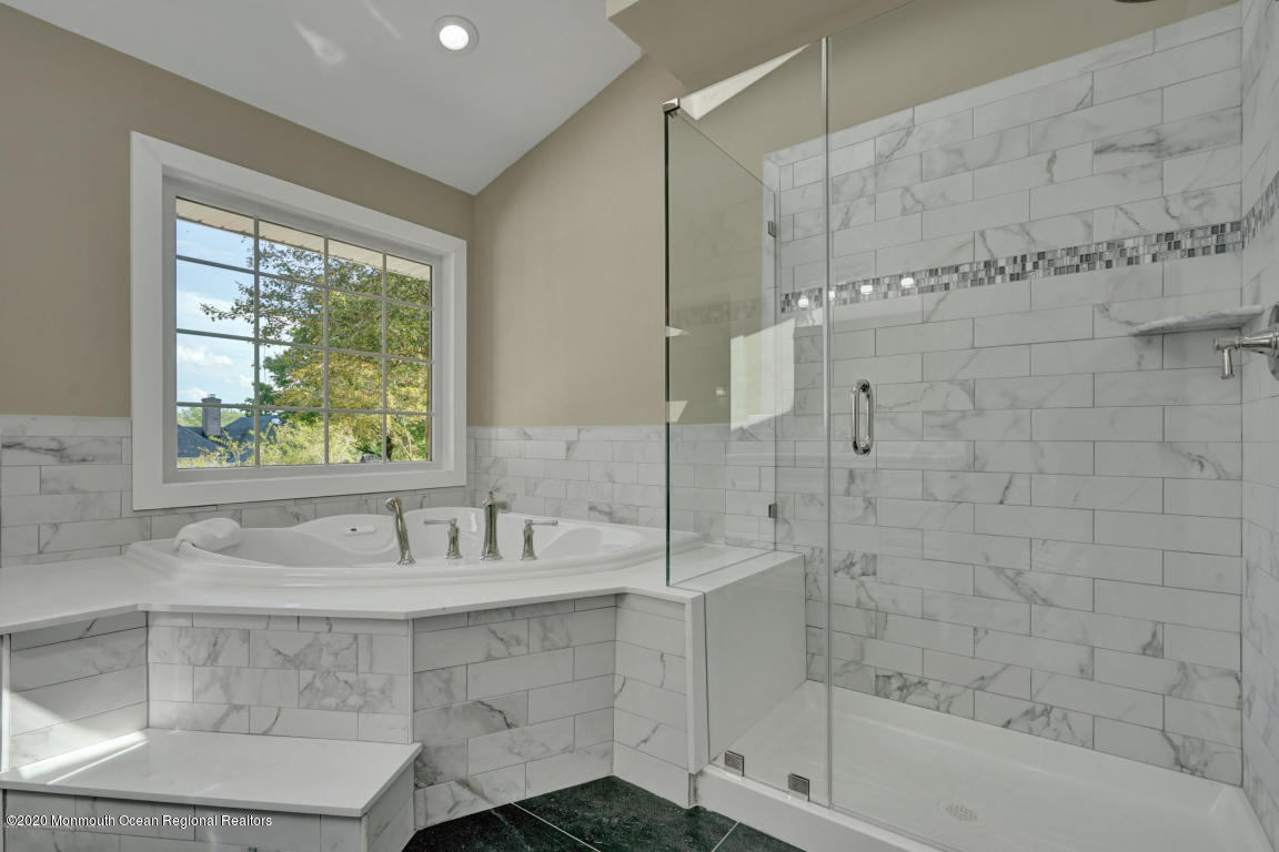 236 Holland Road Holmdel, NJ 07733 - Photo 26 of 42 a bathroom with a bathtub and a shower