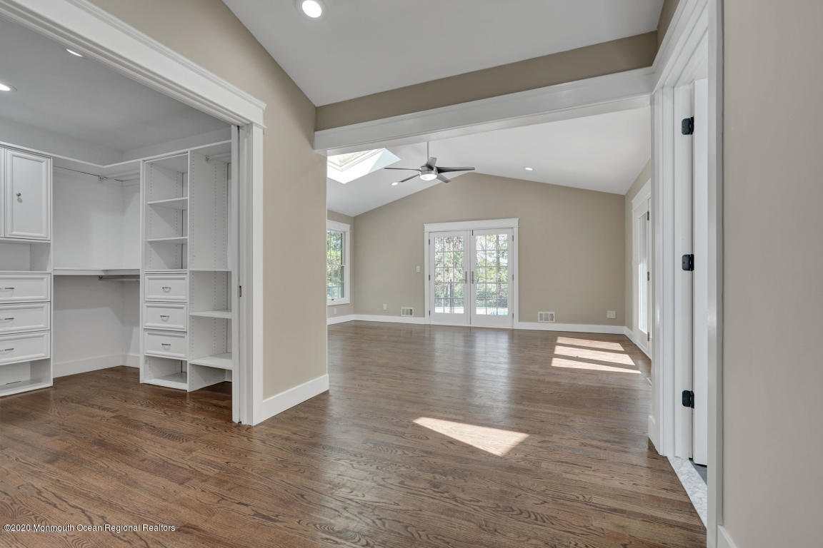 236 Holland Road Holmdel, NJ 07733 - Photo 28 of 42 a view of a livingroom with wooden floor and staircase