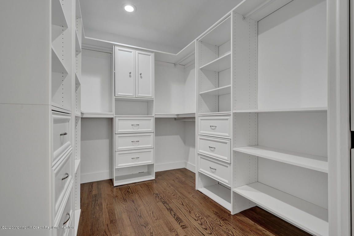 236 Holland Road Holmdel, NJ 07733 - Photo 29 of 42 a view of walk in closet with empty racks