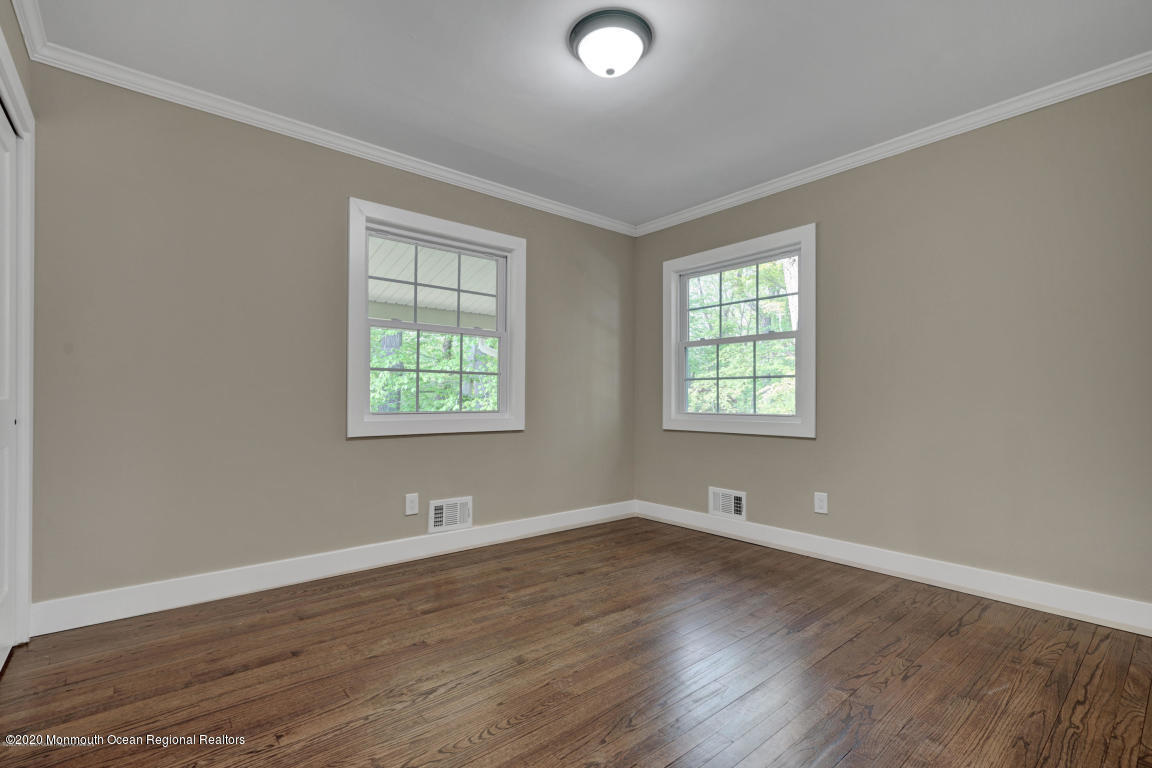 236 Holland Road Holmdel, NJ 07733 - Photo 31 of 42 wooden floor in an empty room with a window