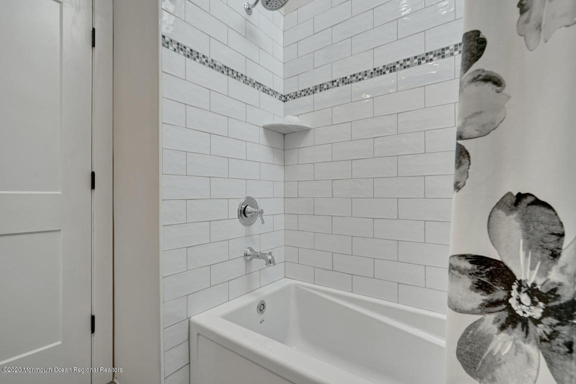 236 Holland Road Holmdel, NJ 07733 - Photo 33 of 42 a bathroom with a sink a bathtub and shower