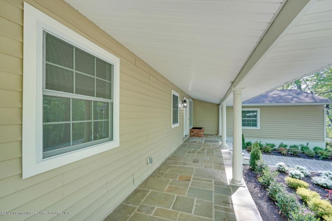 236 Holland Road Holmdel, NJ 07733 - Photo 35 of 42 a front view of a house with a yard