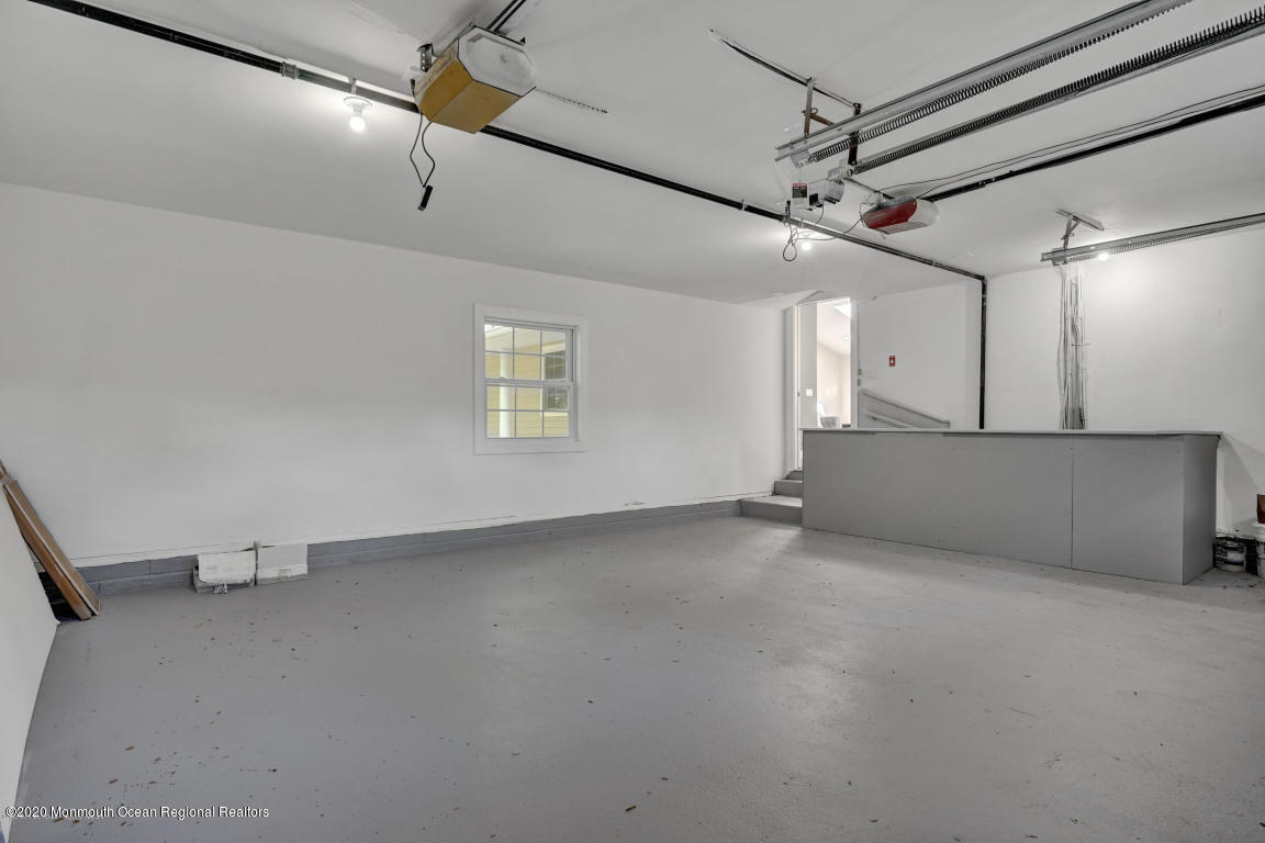 236 Holland Road Holmdel, NJ 07733 - Photo 39 of 42 a view of an empty room with a window