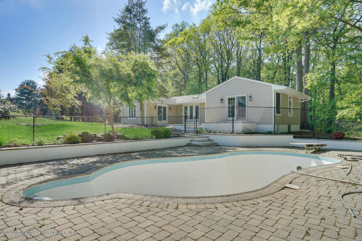 236 Holland Road Holmdel, NJ 07733 - Photo 41 of 42 a view of a house with a yard and sitting area