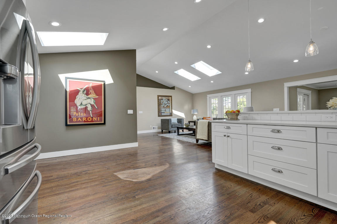 236 Holland Road Holmdel, NJ 07733 - Photo 6 of 42 a living room with furniture and a flat screen tv