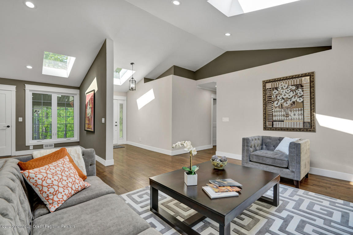 236 Holland Road Holmdel, NJ 07733 - Photo 8 of 42 a living room with furniture and wooden floor