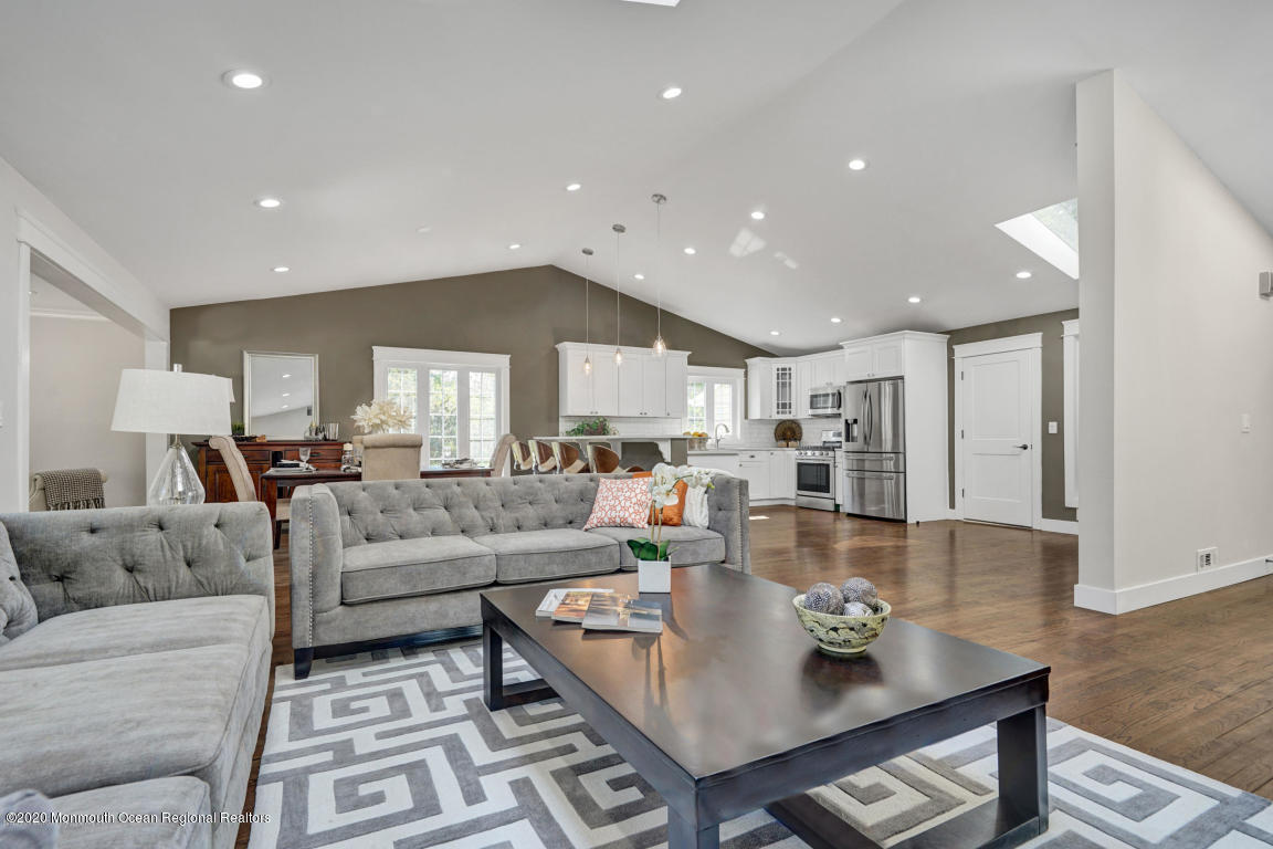 236 Holland Road Holmdel, NJ 07733 - Photo 9 of 42 a living room with lots of furniture and view of kitchen