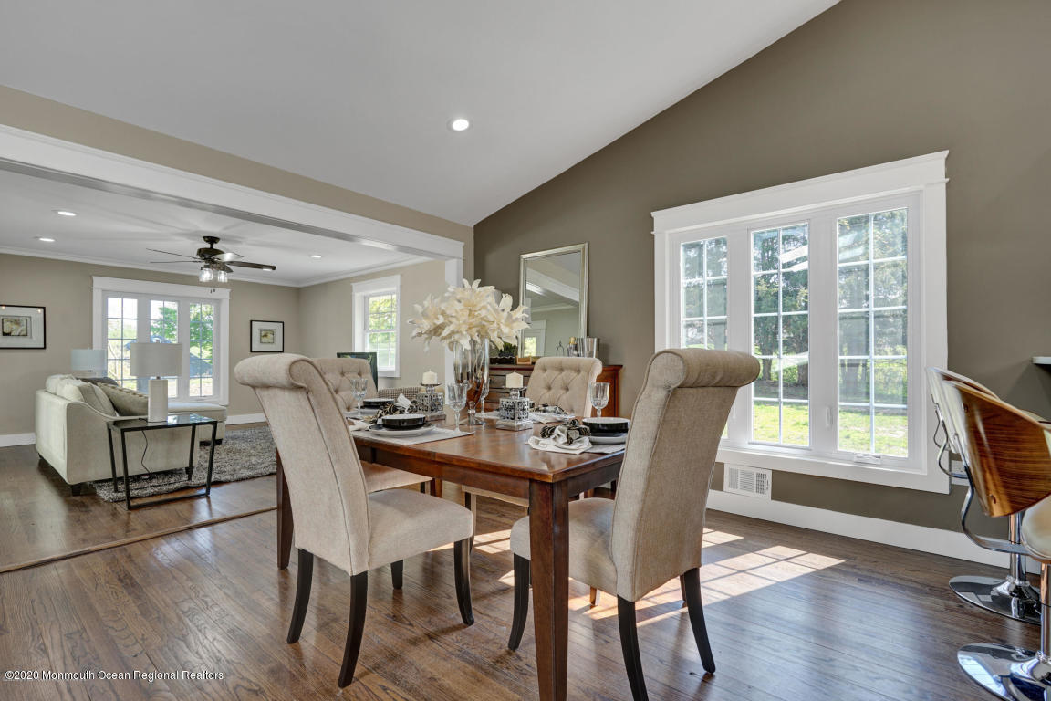 236 Holland Road Holmdel, NJ 07733 - Photo 10 of 42 a view of a dining room with furniture window and wooden floor