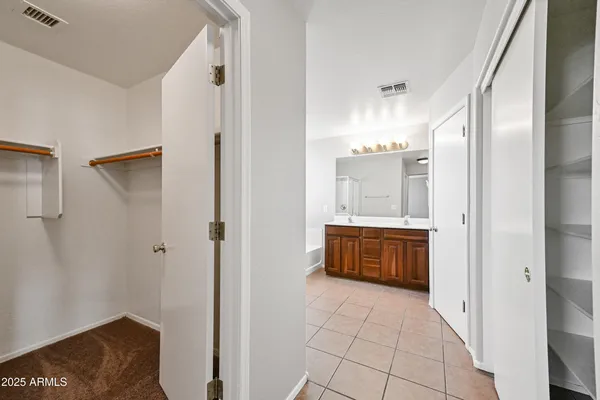 a bathroom with a mirror and a shower
