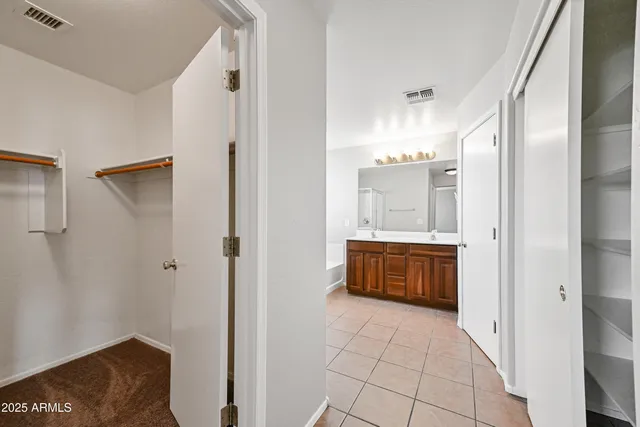 a bathroom with a mirror and a shower