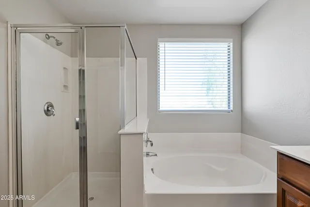 a white bath tub sitting next to a window