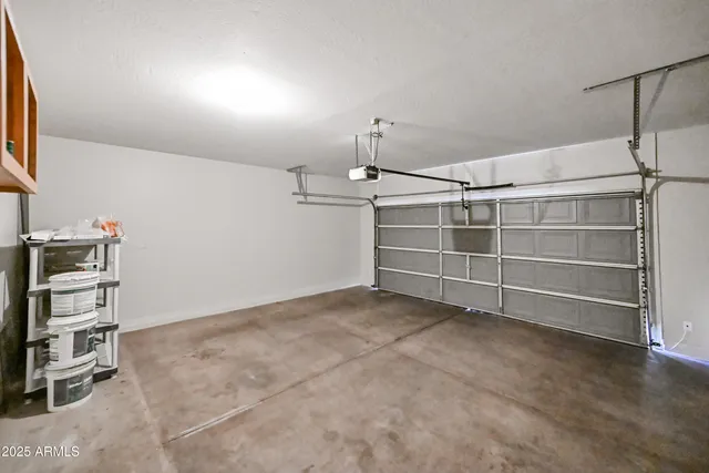 a view of an empty room with empty shelves