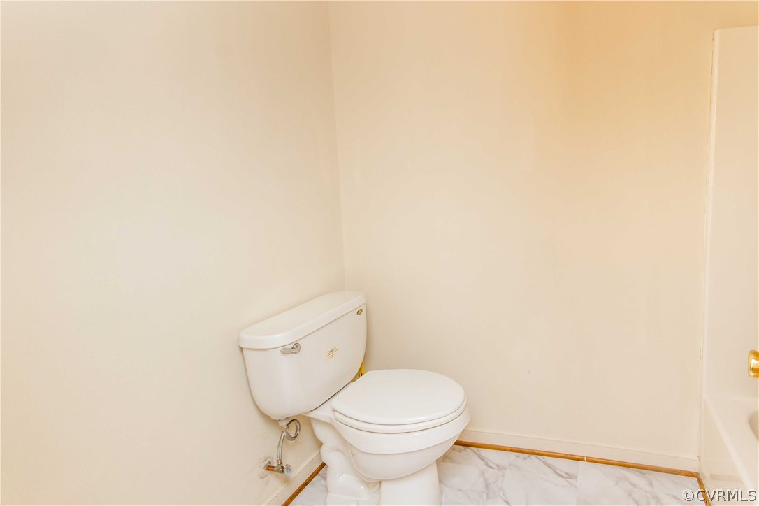 4725 Grubby Road Wilsons, VA 23894 - Photo 33 of 40 a bathroom with a toilet and a sink