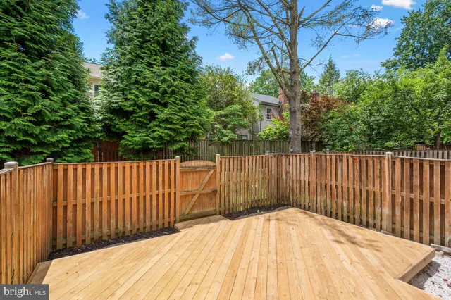 a view of wooden fence and trees