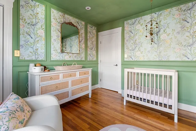a view of a bedroom with furniture and window