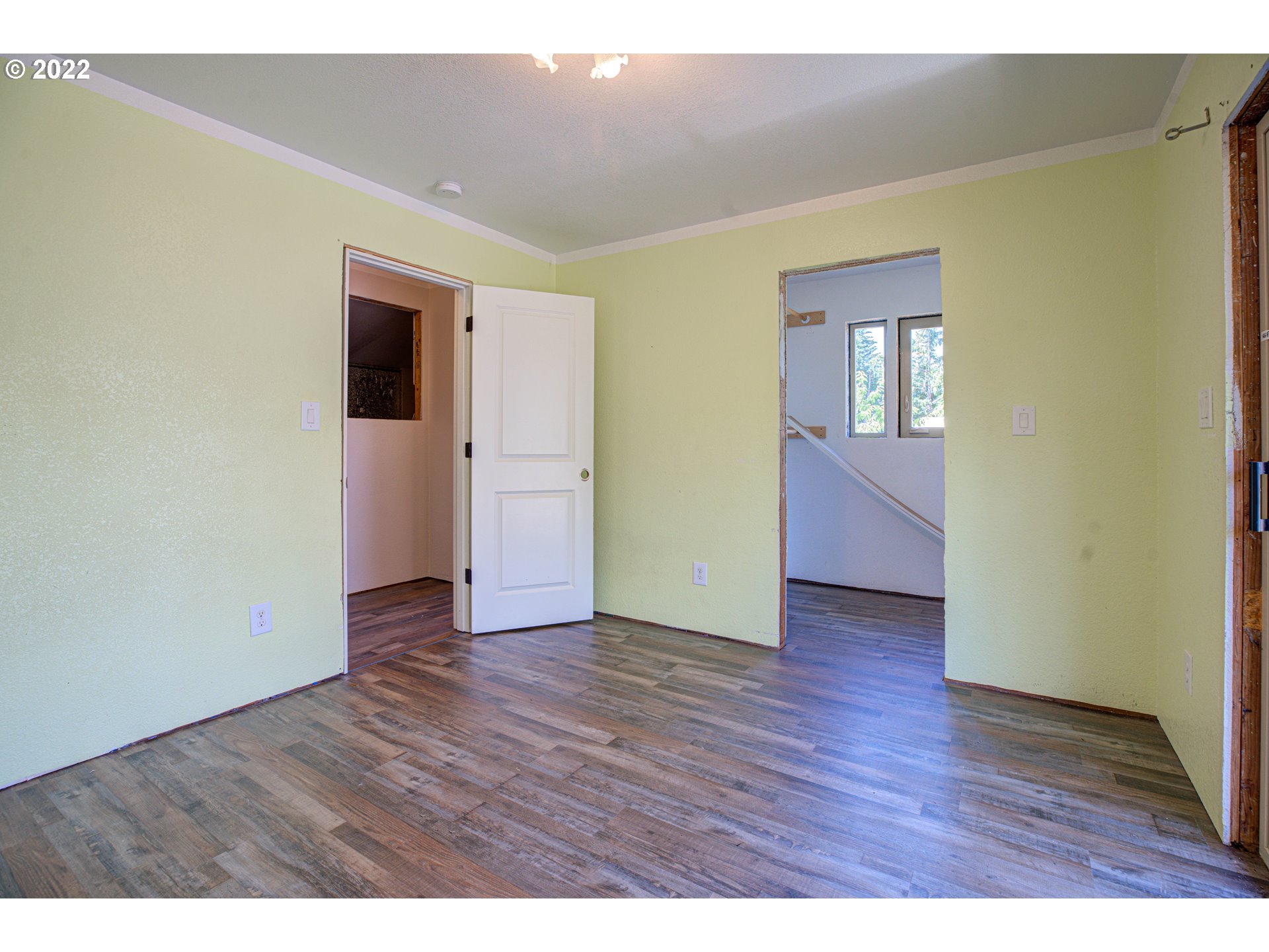 12355 Southeast Winston Road Damascus, OR 97089 - Photo 14 of 27 a view of an empty room with wooden floor