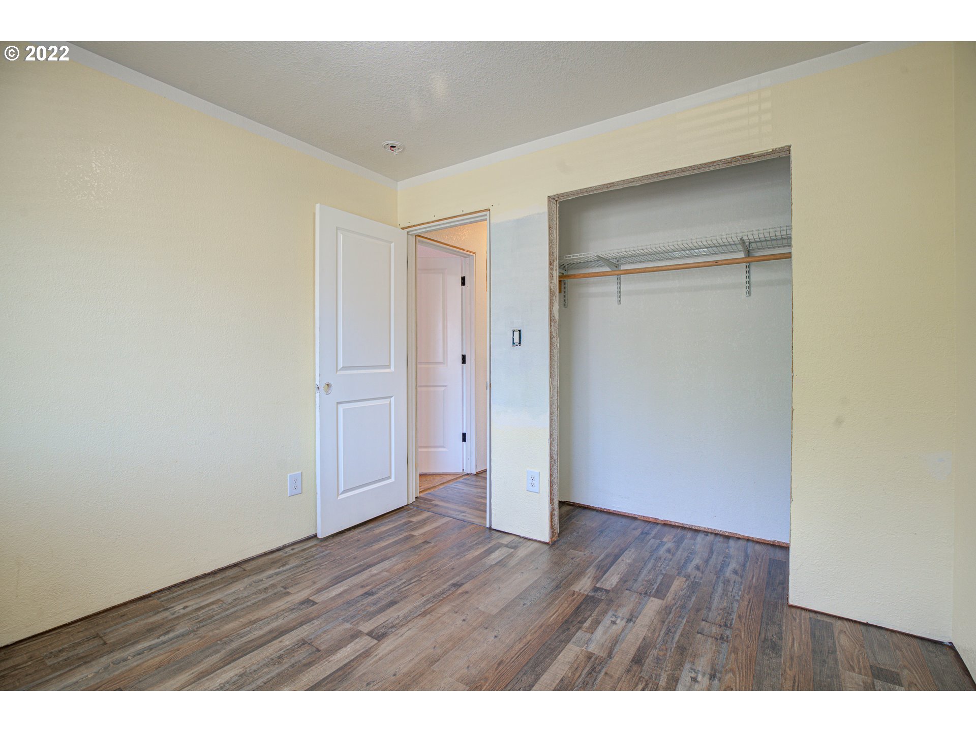 12355 Southeast Winston Road Damascus, OR 97089 - Photo 17 of 27 a view of an empty room with wooden floor