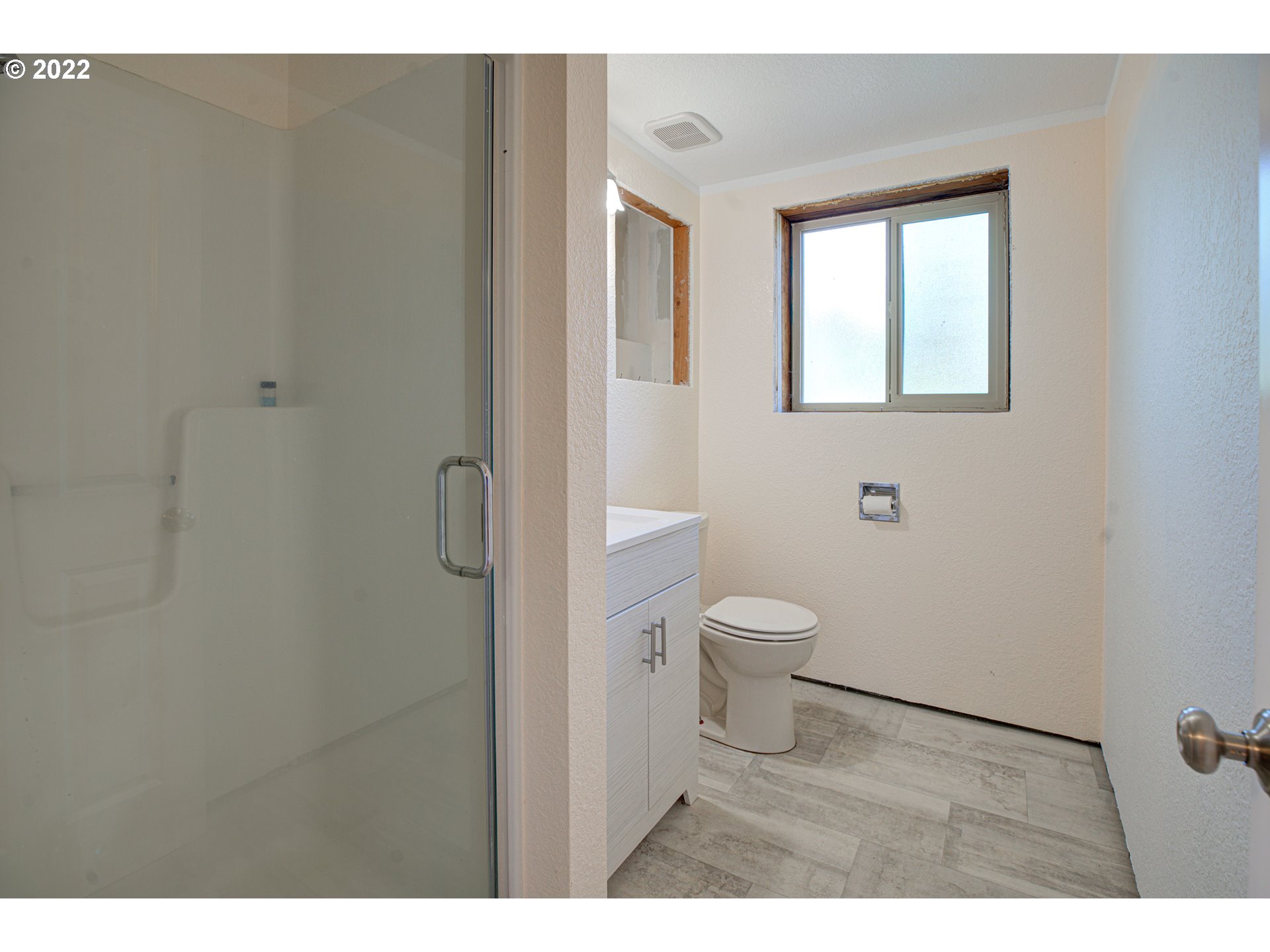 12355 Southeast Winston Road Damascus, OR 97089 - Photo 21 of 27 a bathroom with a toilet and a shower