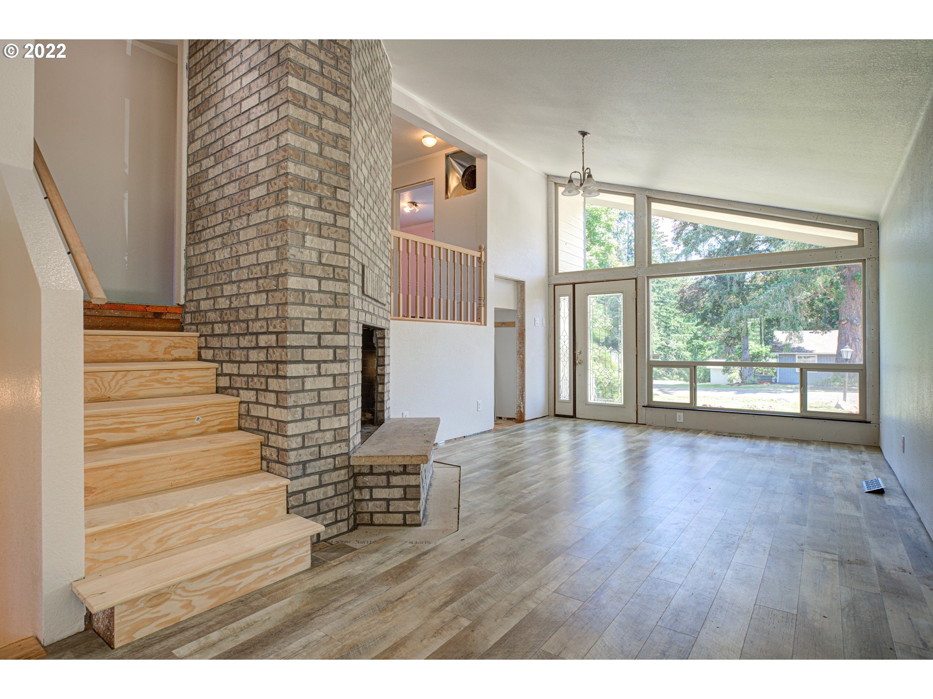 12355 Southeast Winston Road Damascus, OR 97089 - Photo 7 of 27 a view of an entryway with wooden floor