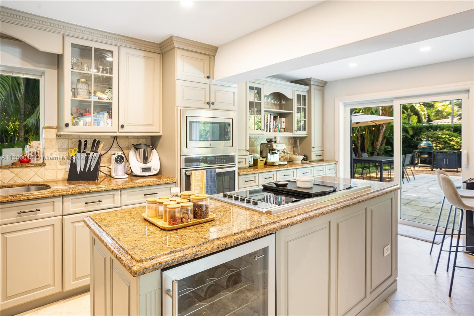 441 Miller Road Coral Gables, FL 33146 - Photo 11 of 34 a kitchen with a sink stove and cabinets