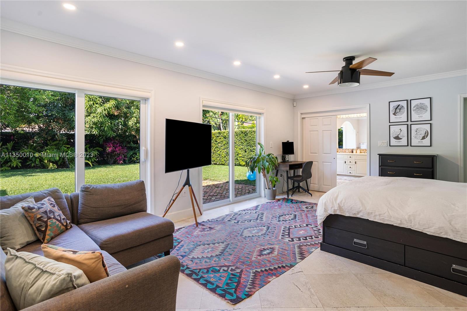 441 Miller Road Coral Gables, FL 33146 - Photo 16 of 34 a living room with furniture fireplace and a large window
