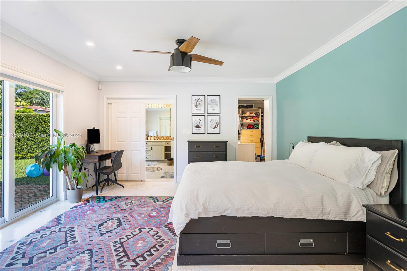 441 Miller Road Coral Gables, FL 33146 - Photo 17 of 34 a living room with a bed furniture and a flat screen tv
