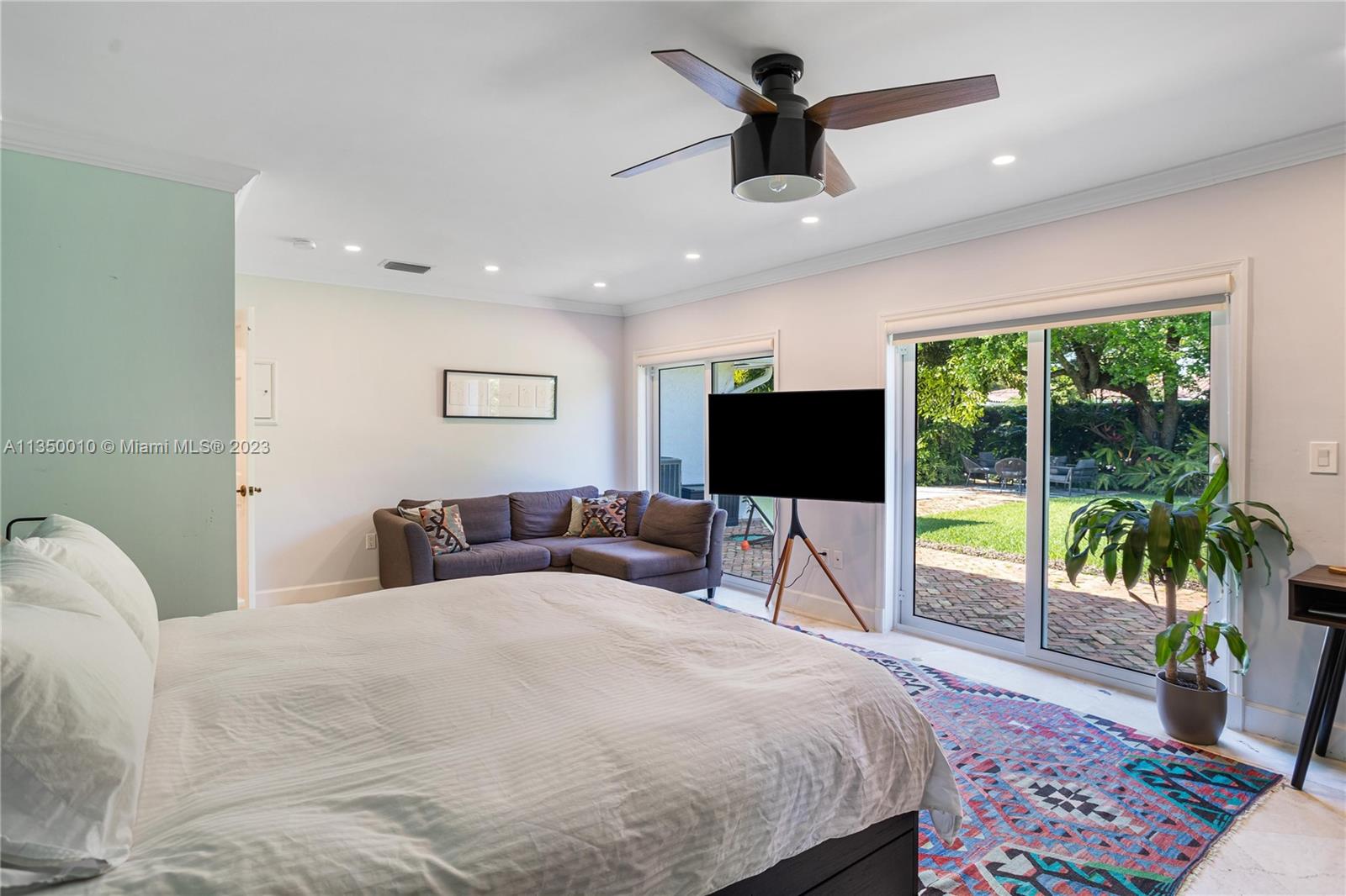441 Miller Road Coral Gables, FL 33146 - Photo 18 of 34 a bedroom with a bed and a flat screen tv