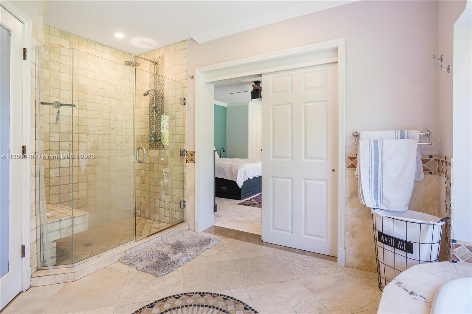 441 Miller Road Coral Gables, FL 33146 - Photo 20 of 34 a bedroom with a bed and a bathroom